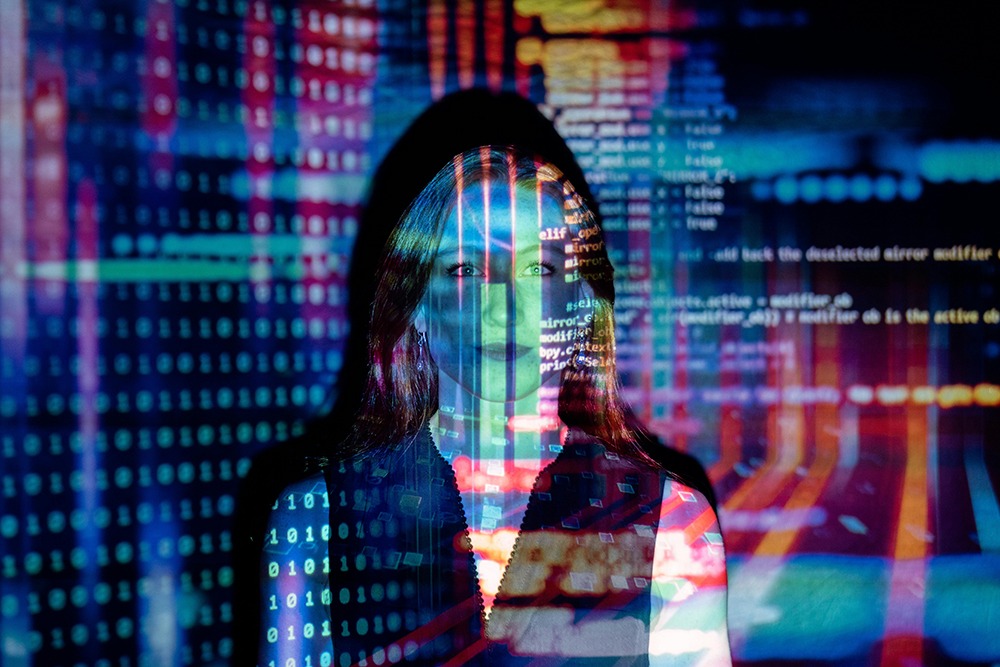 Colorful digital image being projected on a woman